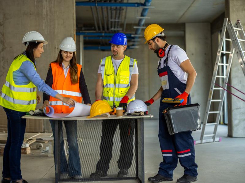 Site supervisor conducting safety audit with compliance checklist