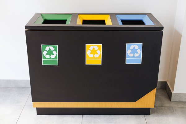 Organized commercial waste recycling bins and skip container setup